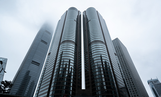 Hong Kong Skyscrapers upon overcast sky prior rainstorm;