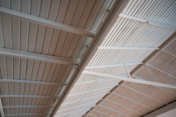 istock Wooden structure of a complex, tapered roof. Wood processing 1340491656
