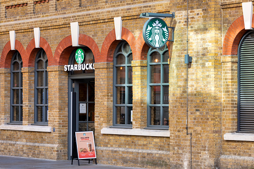 London, United Kingdom - Sep 7, 2021: Starbucks Coffee located in London. Starbucks Corporation is an international coffee and coffeehouse chain based in Seattle, Washington.