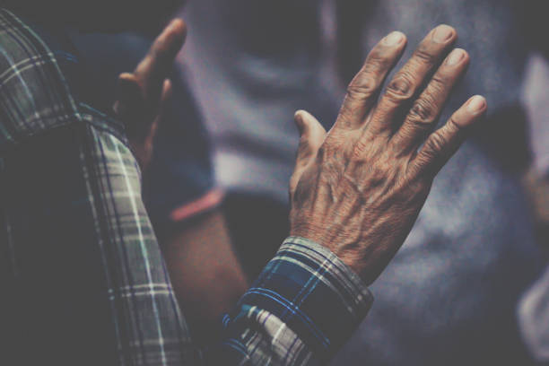 istock People praying together at Church. 1340498341