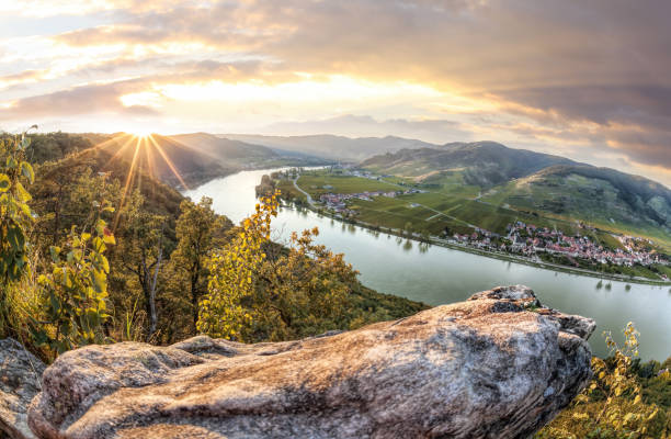 Panorama of Wachau valley (Unesco world heritage site) with Danube river at colorful sunset against Duernstein village in Lower Austria, Austria Panorama of Wachau valley (Unesco world heritage site) with Danube river at colorful sunset against Duernstein village in Lower Austria, Austria vienna austria photos stock pictures, royalty-free photos & images