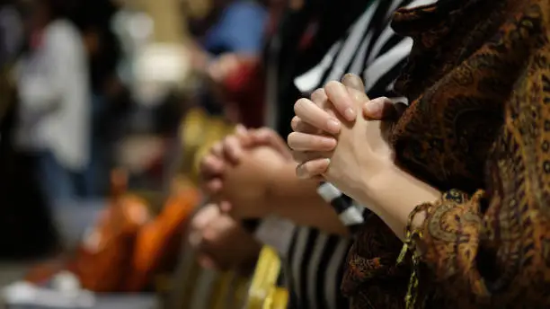 Photo of People praying together at Church.