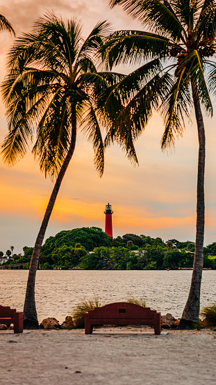 Historic Jupiter Lighthouse surrounded by palm trees in Jupiter, Florida