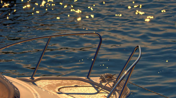 istock Moored boats in a cornish harbour in autumnal light 1340506963