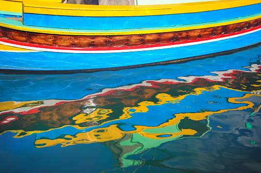 Abstract detail of a traditional Maltese colorful boat called Luzzu in Marsaxlokk, Malta.