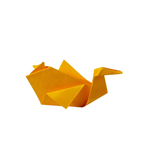istock Origami paper craft: yellow bird on a white background 1340513887