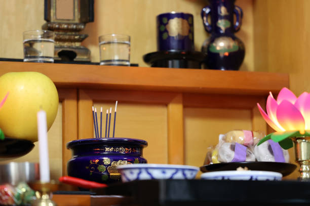 Buddhist altar with offerings and incense sticks