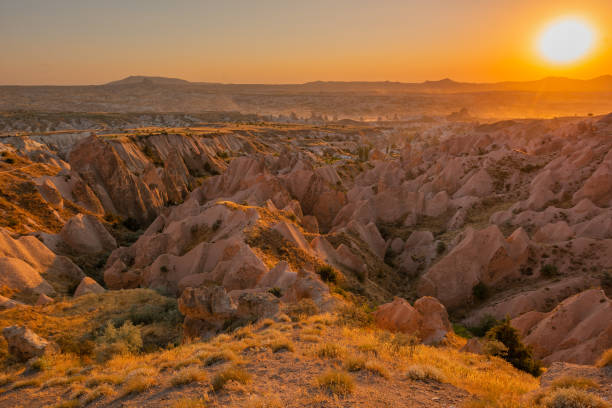 Red Valley, Cappadocia Sunset view in Red Valley, Cappadocia. Volcanic mountains in Goreme national park. rose valley stock pictures, royalty-free photos & images