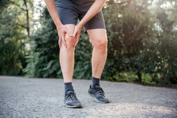 istock A man having difficulty in straightening or bending the knee because of bursitis 1340520041