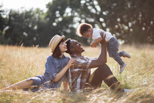 istock Positive multi ethnic family playing together on nature 1340520377