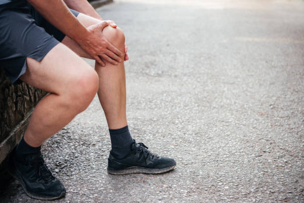 istock Man having knee pain while exercising, sports injuries concept 1340520653
