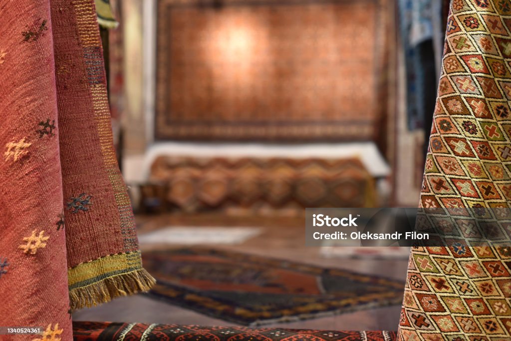 Turkish vintage carpets store Turkish vintage carpets store in selective focus with blurry background in center Old-fashioned Stock Photo