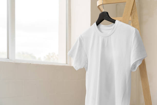 istock Plain white cotton t-shirt on hanger for your design 1340524385
