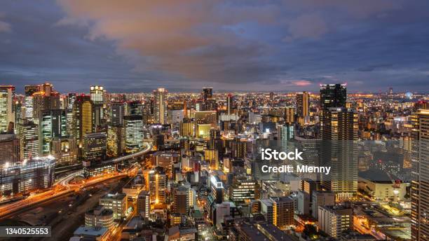 Osaka Japan Illuminated Downtown Cityscape Panorama At Sunset Stock Photo - Download Image Now