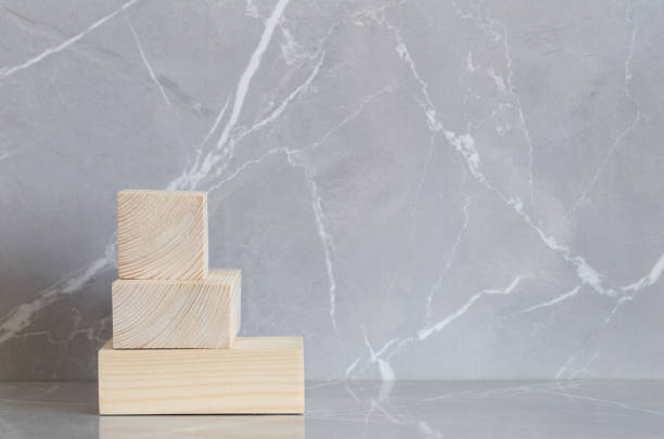 istock wooden podium on gray marble background 1340528133