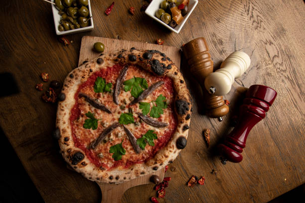 Neapolitan Pizza Neapolitan pizza with anchovies waled stock pictures, royalty-free photos & images
