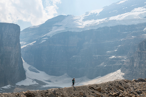 Switzerland Travel - Rear view of woman hiking the mountains near Gorner Glacier