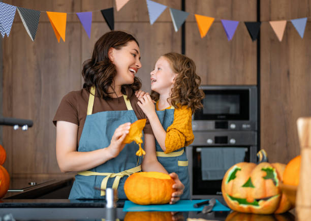 istock family preparing for Halloween. 1340529075