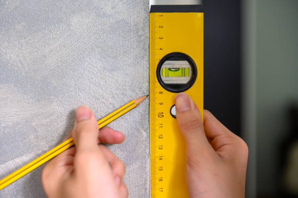 istock Marking measurement with alloy level ruler 1340529284