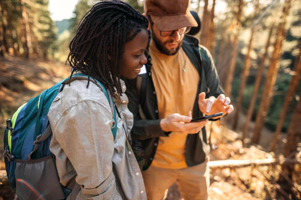 istock Young couple enjoying beautiful forest 1340530723