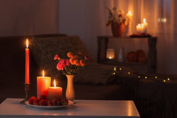 istock autumn decorations with burning candles at home 1340531361
