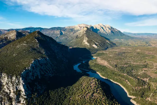View from above, stunning aerial view of the Cedrino Lake - Lago del Cedrino, surrounded by the mountain range of Supramonte located northeast of the Gennargentu massif. Sardinia, Italy.
