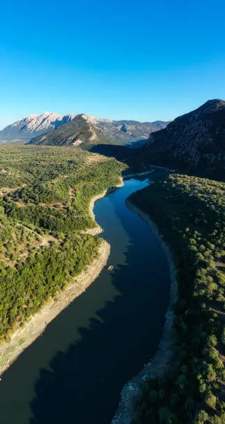 Aerial shot, stunning panoramic view of the Cedrino Lake - Lago del Cedrino, surrounded by the mountain range of Supramonte located northeast of the Gennargentu massif. Sardinia, Italy.