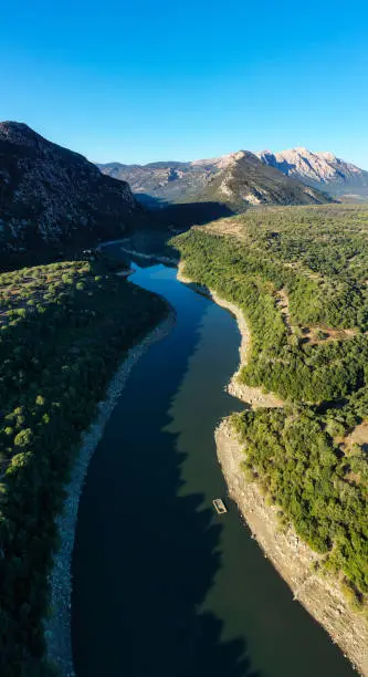 Aerial shot, stunning panoramic view of the Cedrino Lake - Lago del Cedrino, surrounded by the mountain range of Supramonte located northeast of the Gennargentu massif. Sardinia, Italy.
