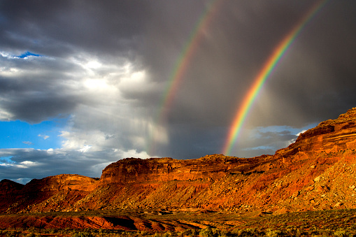 A summer storm creates double rainbows over the Comb Ridge in Bears Ears National Monument,
