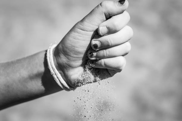 istock Girl letting hand drift through her fingers 1340538844