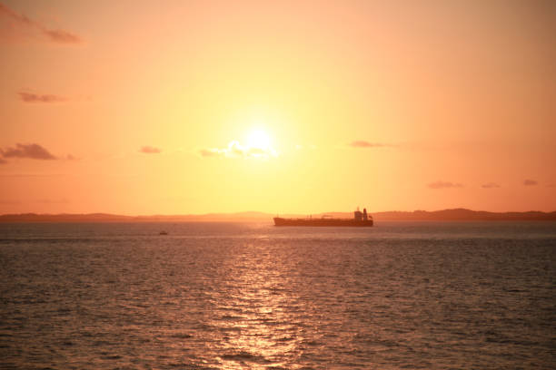 salvador, bahia, brazil - september 12, 2021: ship is seen during sunset in the waters of the bay of all saints in the city of Salvador.