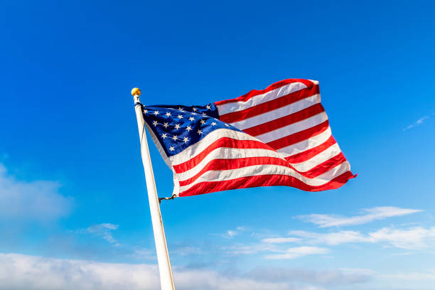 istock USA flag waving against sky 1340542203