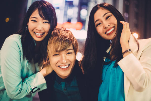 istock Joyful japanese friends in Osaka by night 1340542778