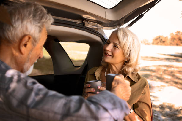 istock Senior couple Having Coffee in nature 1340544041