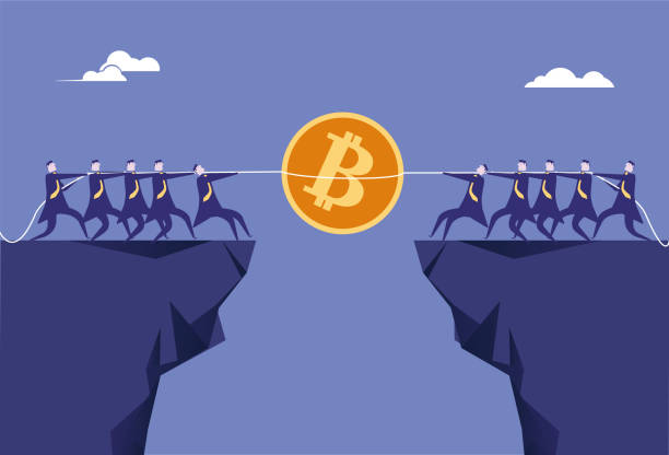 istock Two teams compete for Bitcoin in a tug-of-war on the cliff 1340545340