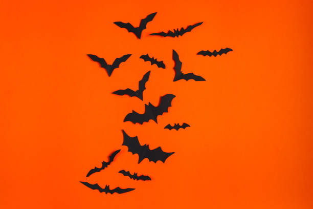 istock Happy Halloween. Paper bats on orange background. 1340546367