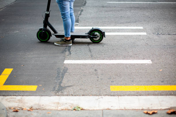 istock Electric scooter standing on the road 1340546388