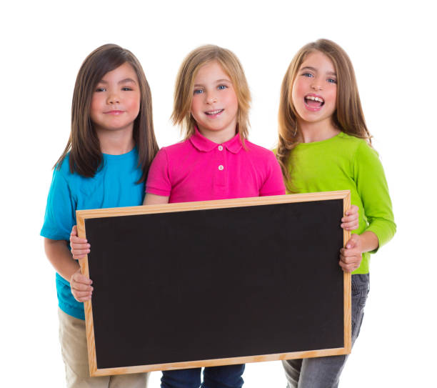 istock children girls group holding blank blackboard copy space 1340547215
