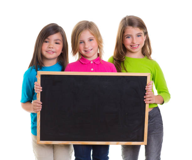 istock children girls group holding blank blackboard copy space 1340547280