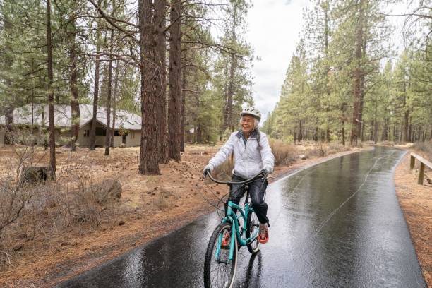 istock Active ethnic retired woman  having fun on a bike ride 1340548925