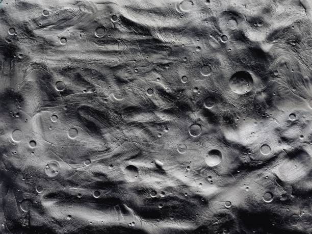 istock Impact craters on the surface of the moon 1340549611