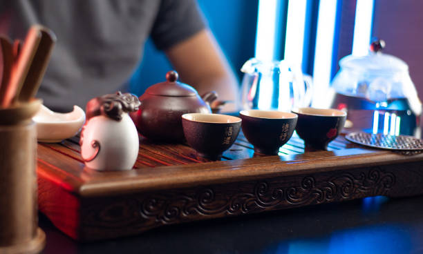 istock a man makes tea at a tea table with appliances according to the traditional Chinese tradition 1340552185
