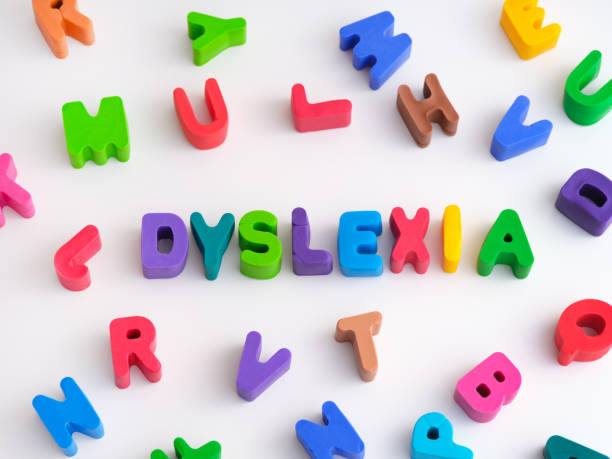 The word Dyslexia made out of play clay letters with other play clay letters surrounding it The word Dyslexia made out of play clay letters with other play clay letters surrounding it. Close up. cirrocumulus stock pictures, royalty-free photos & images