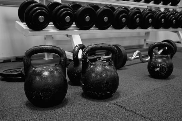 istock kettlebell weights on rubber floor ready for strength and conditioning workout, black and white image 1340553220