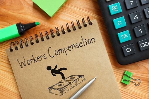 Workers Compensation is shown on a business photo using the text