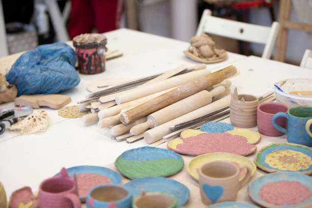 istock Clay products in the workshop on the table. Clay modeling master class. 1340555659