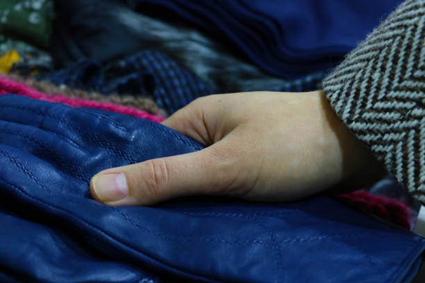 istock The girl takes gloves when going outside. 1340558813