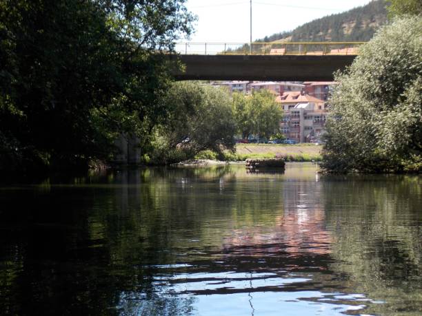istock a bridge with a yellow fence over the river 1340560936