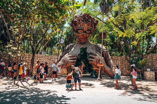 Tulum, Mexico. May 25, 2021. Tourist beachgoers photographing in front of Ven a La luz sculpture installed at the resort Ahau