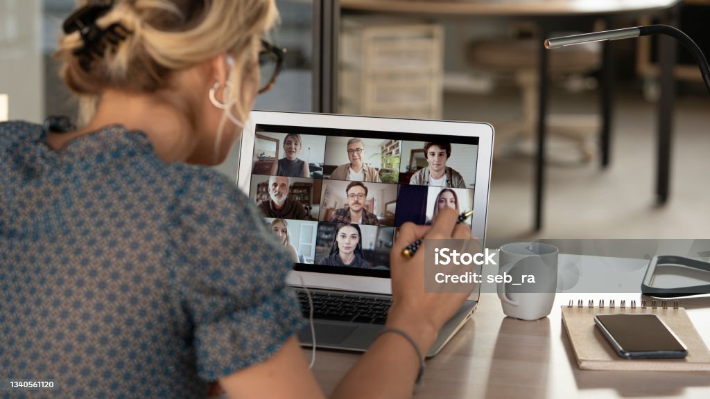 Talking and working on video calling Web Conference Stock Photo